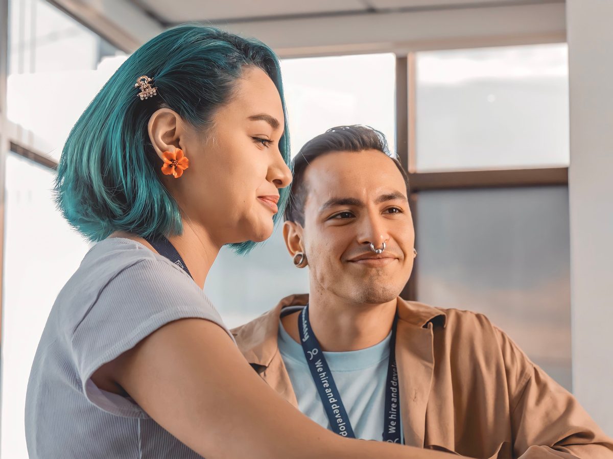 Two colleagues sharing a relaxed, candid moment